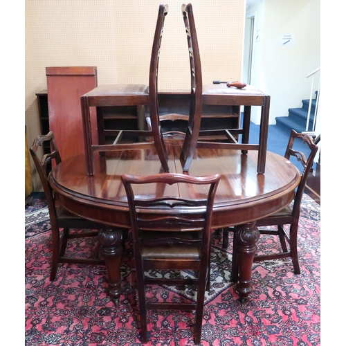 106 - A Victorian mahogany oval wind out extending dining table on turned supports, 75cm high x 157cm long... 