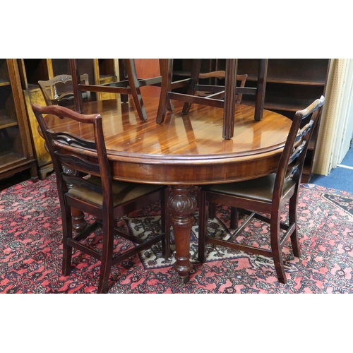 106 - A Victorian mahogany oval wind out extending dining table on turned supports, 75cm high x 157cm long... 