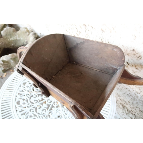 132 - An 20th century elm and beech garden wheelbarrow, 36cm high x 102cm long x 44cm deep