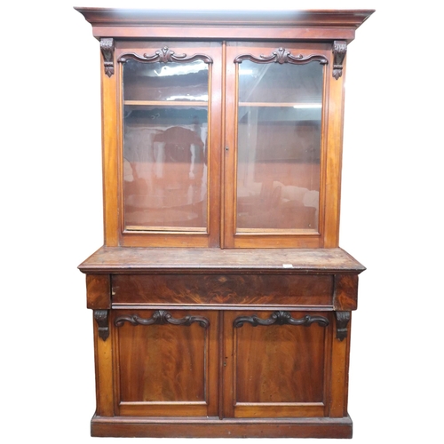 19 - A Victorian mahogany glazed library style bookcase with moulded cornice over pair of glazed doors on... 