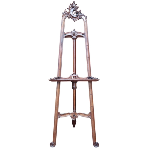 2 - A 20th century continental style freestanding easel with carved pierced detail, 173cm high x 60cm de... 