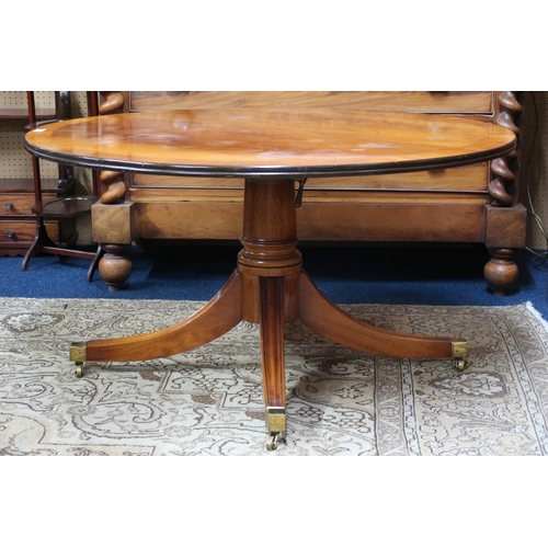 21 - A 20th century mahogany circular topped coffee table on quadrupedal base, 55cm high x 107cm diameter