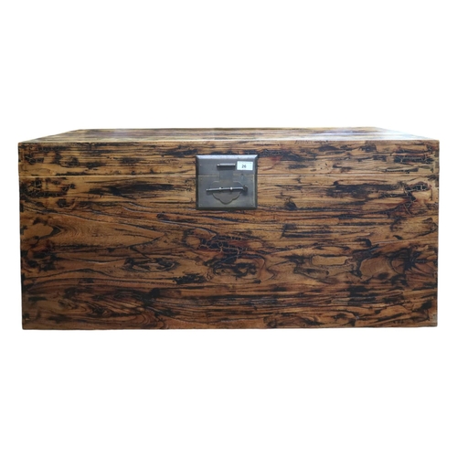 26 - A 20th century Chinese elm blanket chest with brass latch and carry handles, 49cm high x 106cm wide ... 