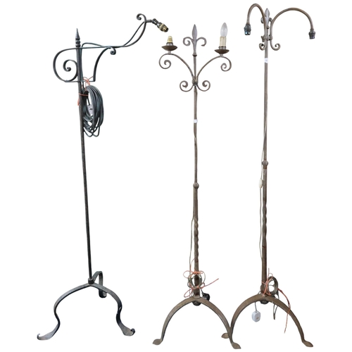 31 - A lot comprising three assorted wrought iron standard lamps with tripod bases, tallest 167cm high (3... 