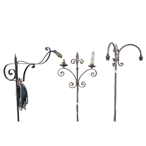 31 - A lot comprising three assorted wrought iron standard lamps with tripod bases, tallest 167cm high (3... 