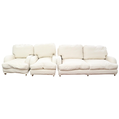 34 - A contemporary cream upholstered three piece suite comprising three seater settee, 78cm high x 197cm... 