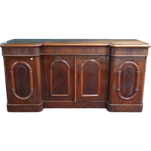 36 - A Victorian mahogany inverted breakfront sideboard with central long drawer over pair of cabinet doo... 