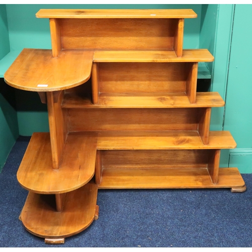 37 - A 20th century beech open corner cabinet with five stepped shelves on stepped feet, 96cm high x 120c... 