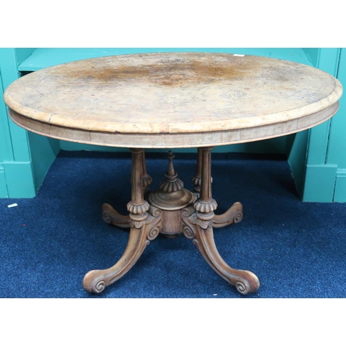 38 - A 19th century walnut veneered oval topped window table on carved out swept quadrupedal base, 70cm h... 