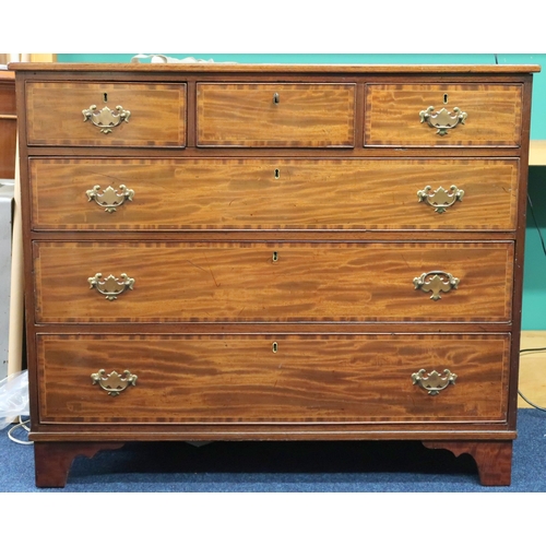 41 - A 19th century mahogany chest of drawers with three short over three long drawers with crossbanded d... 