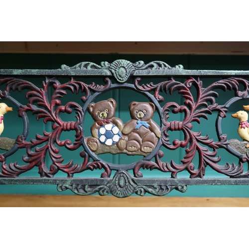 42 - A 20th century child's cast metal framed garden bench decorated with teddy bears, ducks and grapes o... 