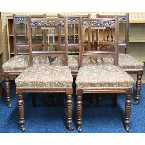 50 - A set of five Victorian oak dining chairs with floral upholstered seat on turned supports, 94cm high... 