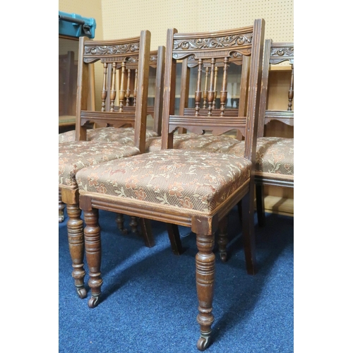 50 - A set of five Victorian oak dining chairs with floral upholstered seat on turned supports, 94cm high... 