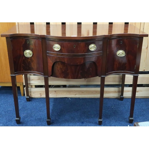 53 - An early 20th century mahogany serpentine front sideboard with two central drawers flanked by cabine... 