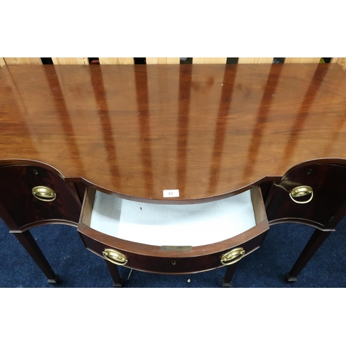 53 - An early 20th century mahogany serpentine front sideboard with two central drawers flanked by cabine... 