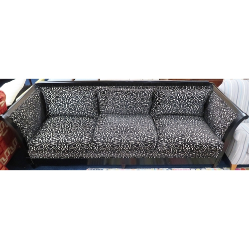 65 - A large contemporary Verona Majestic four seater sofa with embossed damask upholstery on ebonised fr... 