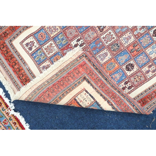 68 - A multicoloured ground Bakhtiari rug with all over panel design within red geometric border, 189cm l... 