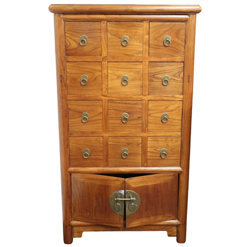 7 - A 20th century Chinese hardwood apothecary style tall boy chest of drawers with four rows of three s... 