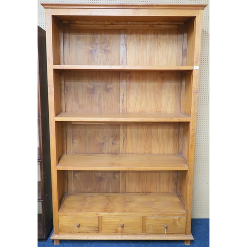 73 - A contemporary cherry open bookcase with moulded cornice over four open shelves over three short dra... 