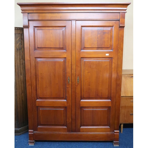 79 - A contemporary And So To Bed, London cherry wardrobe with moulded cornice over pair of panel doors o... 