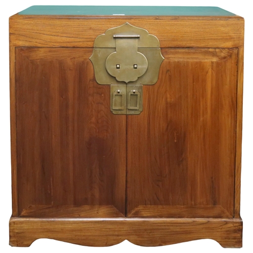 8 - A 20th century Chinese hardwood side cabinet with pair of brass mounted doors flanked by twinned car... 