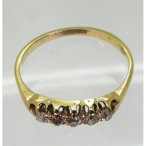 716 - A bright yellow metal vintage ring set with five old cut diamonds, finger size M1/2, weight 1.9gms