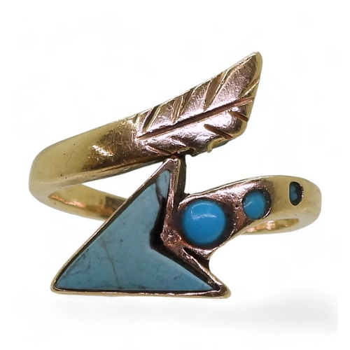 717 - A yellow metal bespoke ring with an arrow design set with turquoise, size Q1/2, weight 6.3gms