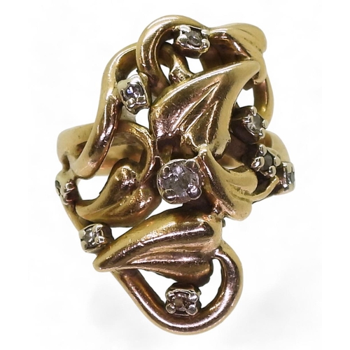 719 - A further ring from the same designer, with a heart shaped leaf and vine design, set with diamonds, ... 