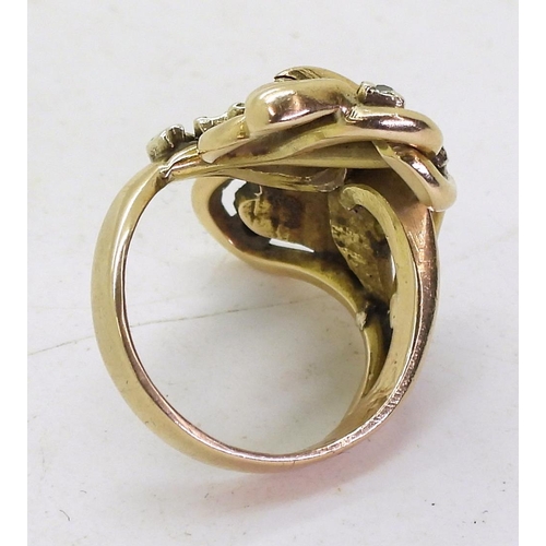 719 - A further ring from the same designer, with a heart shaped leaf and vine design, set with diamonds, ... 