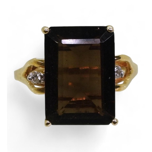 723 - A 14k gold smoky quartz and diamond ring, size N1/2, weight 3.4gms