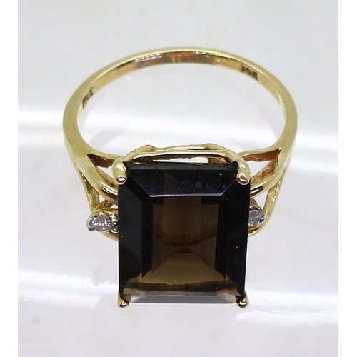 723 - A 14k gold smoky quartz and diamond ring, size N1/2, weight 3.4gms