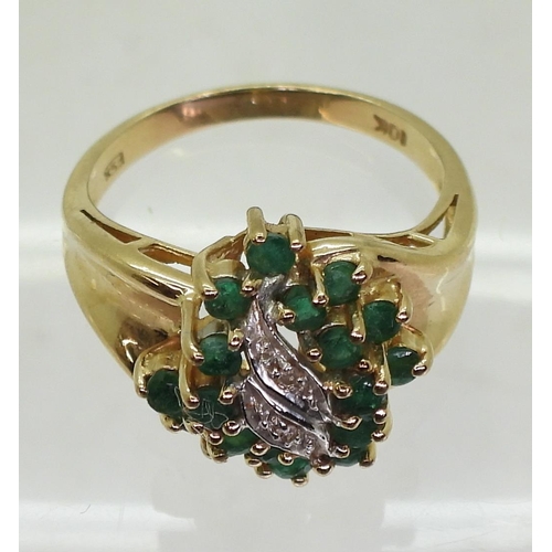 724 - A 10k gold emerald and diamond cluster ring, size N1/2, weight 3.7gms