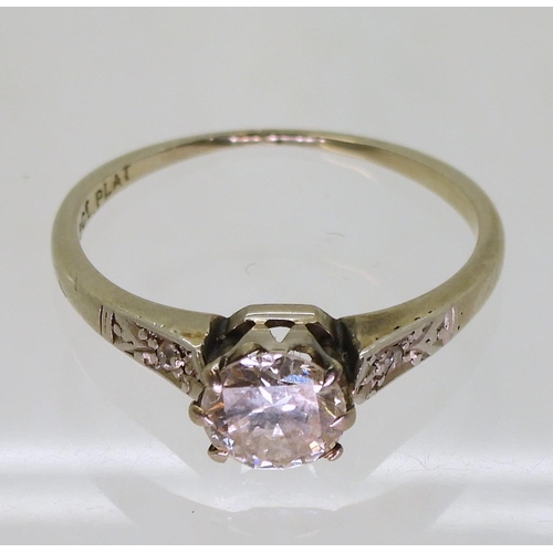 725 - An 18ct and platinum vintage diamond solitaire ring, set with an estimated approx 0.67cts brilliant ... 