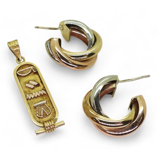 732 - A bright yellow metal Arabic gold Egyptian hieroglyph pendant, weight 2.2gms, and a pair of 9ct thre... 