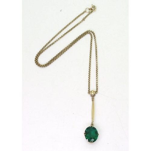 742 - A 9ct gold pendant necklace, set with a green glass gem, length of chain40cm, weight 6.7gms