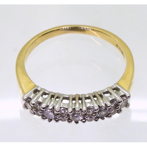 761 - An 18ct gold linear cluster ring, set with estimated approx 0.50cts of brilliant cut diamonds, size ... 