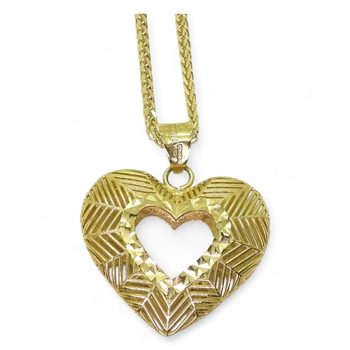 763 - A 9ct gold hollow heart pendant on a 50cm, fancy diamond cut herringbone chain, weight together 2.6g... 