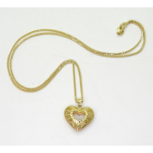 763 - A 9ct gold hollow heart pendant on a 50cm, fancy diamond cut herringbone chain, weight together 2.6g... 