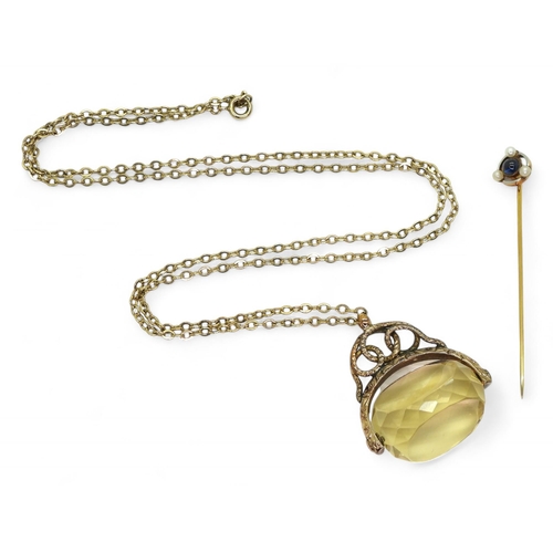 765 - A large citrine fob in 9ct gold mount, on a 62cm 9ct gold trace chain, together with a sapphire and ... 