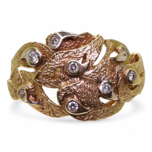 771 - A 9ct gold leaf design ring set with diamond accents, size P, weight 4.5gms