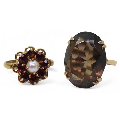 772 - A 9ct gold smoky quartz ring, size N1/2, together with a 9ct gold garnet and pearl flower ring, size... 