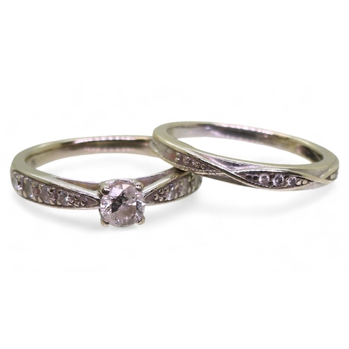 774 - A 9ct white gold diamond solitaire ring with diamond set shoulders, size K1/2, with a matching diamo... 