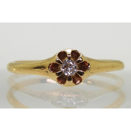 776 - A yellow metal ring gypsy set with a diamond, stamped 14 tot he inner shank, size S, weight 2.1gms