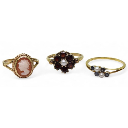 777 - A 9ct gold garnet and pearl ring, size Q1/2, a bright yellow metal ring set with sapphires and pearl... 