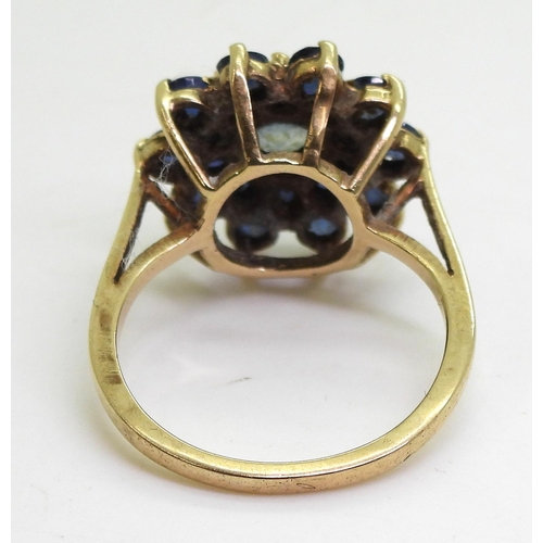 781 - A 9ct gold sapphire cluster ring, size N1/2, weight 4.1gms