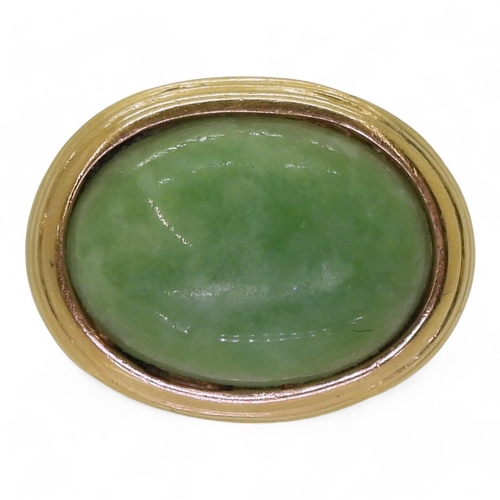 783 - A 9ct gold ring set with a green hardstone, size N, weight 8gms