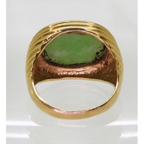 783 - A 9ct gold ring set with a green hardstone, size N, weight 8gms