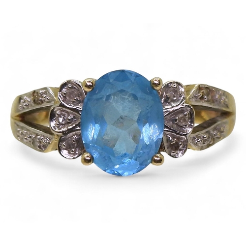 793 - A 9ct gold blue topaz and diamond accent ring, size L, weight 4.1gms