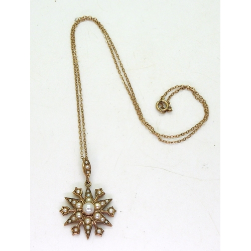 804 - A 9ct gold pearl set star pendant, approx diameter 2.5cm, on a 9ct gold trace chain, 46cm, weight 5.... 