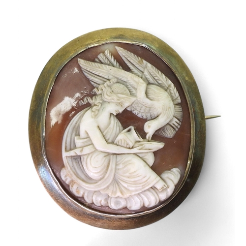 818 - A conch cameo brooch depicting Hebe with Zeus as an eagle, with a woven hair back locket